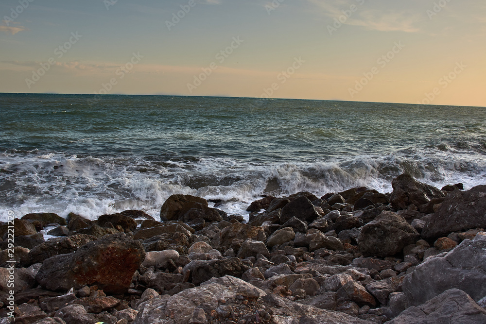 Waves crashing against rocky coast