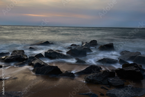 Sunrise on beach with rocks