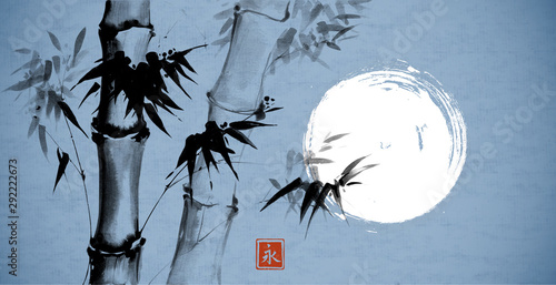 Bamboo and the moon on blue  background. Traditional Japanese ink wash painting sumi-e. Hieroglyph- eternity