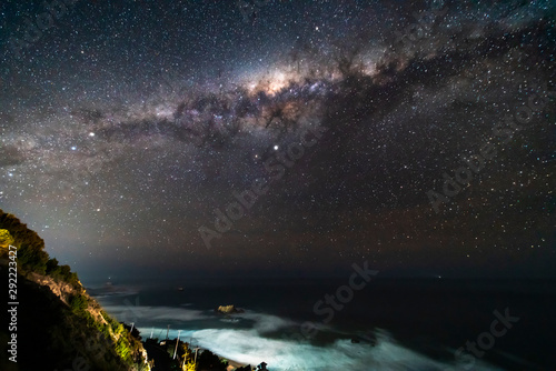 A view of the Milky Way from the southern hemisphere an amazing night sky view above Pacific Ocean sea on a fantasy landscape full of stars with the center of the galaxy showing us its magnificence