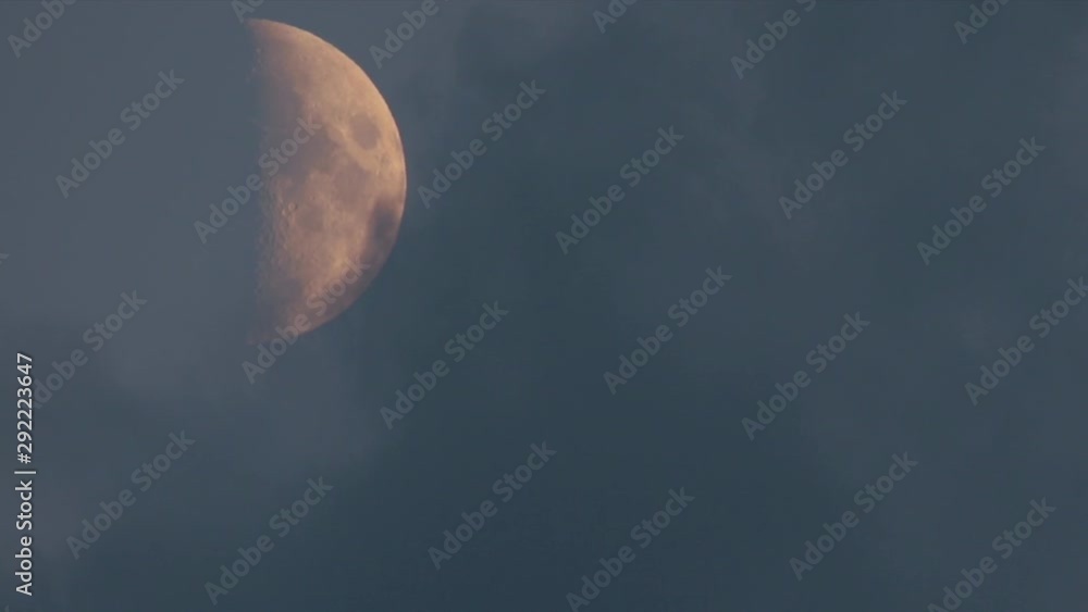 evening half moon obscured by clouds evening half moon obscured by clouds