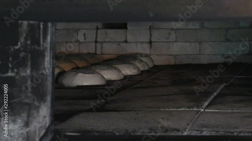Baking bread in a traditional wood-burning oven.