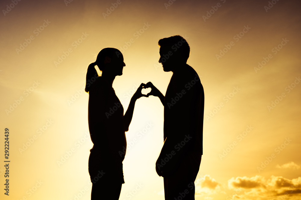 Couple feeling in love at sunset. 