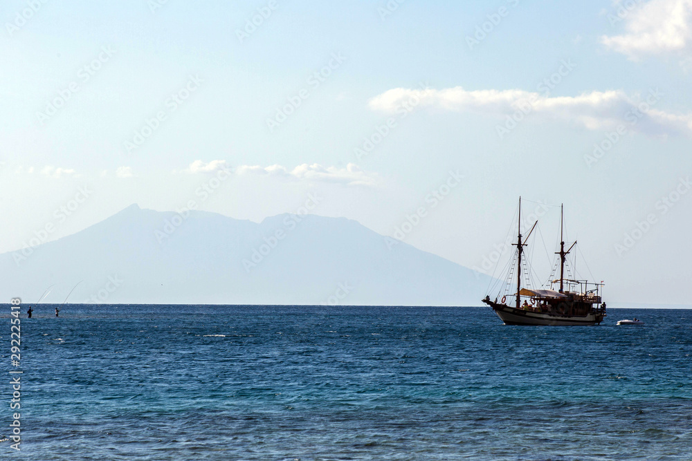 Indonesia Bali, 20 Sept 2019, Bali sea with ship and fishermen Indonesia Bali, 20 Sept 2019, Bali sea with ship and fishermen