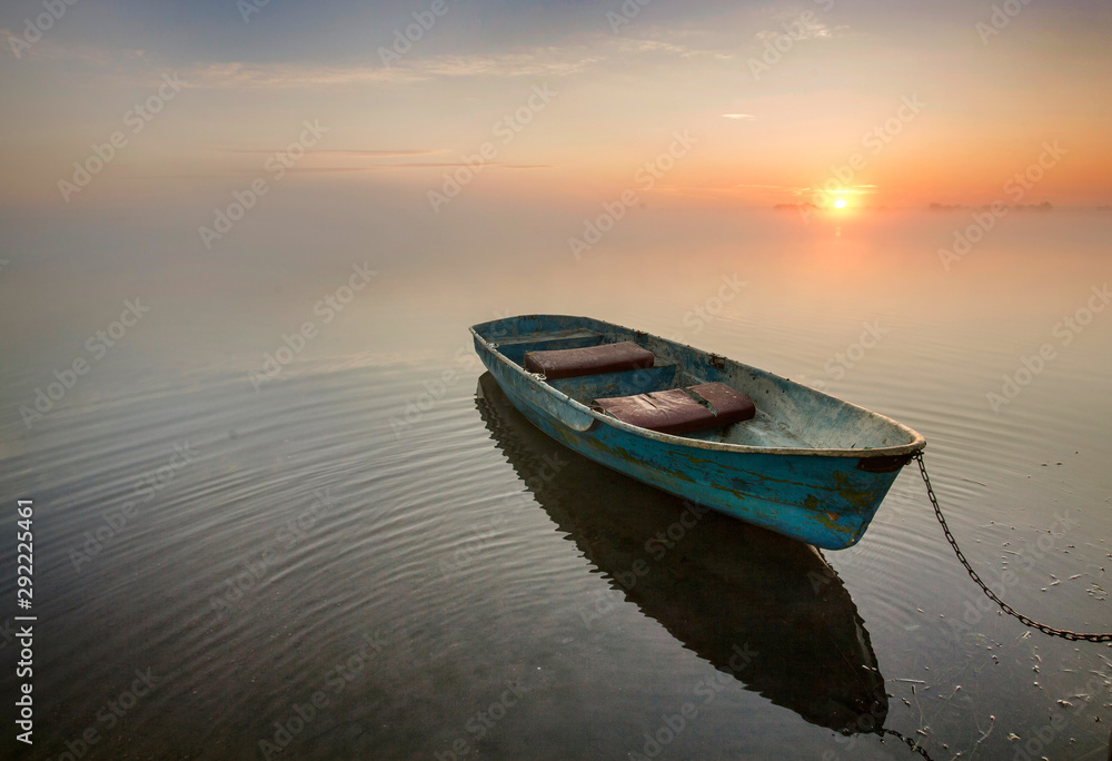 Boats on the lake at dawn.