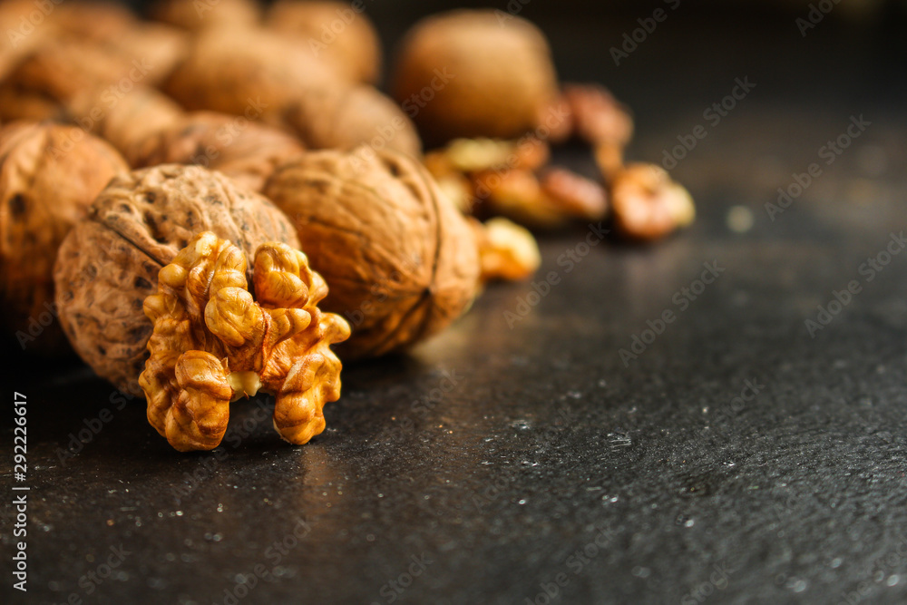 Fototapeta premium Walnuts, tasty and healthy (Kernels, whole nuts) menu concept. food background. copy space. Top view