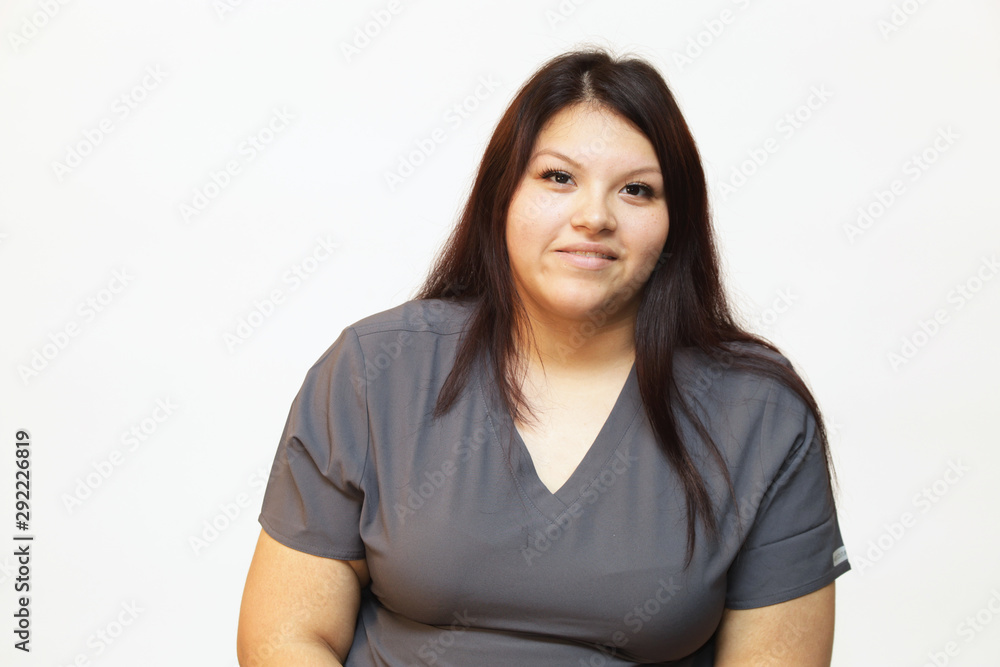 Portrait of a young female healthcare professional, a woman nurse on white background Portrait of a young female healthcare professional, a woman nurse on white background