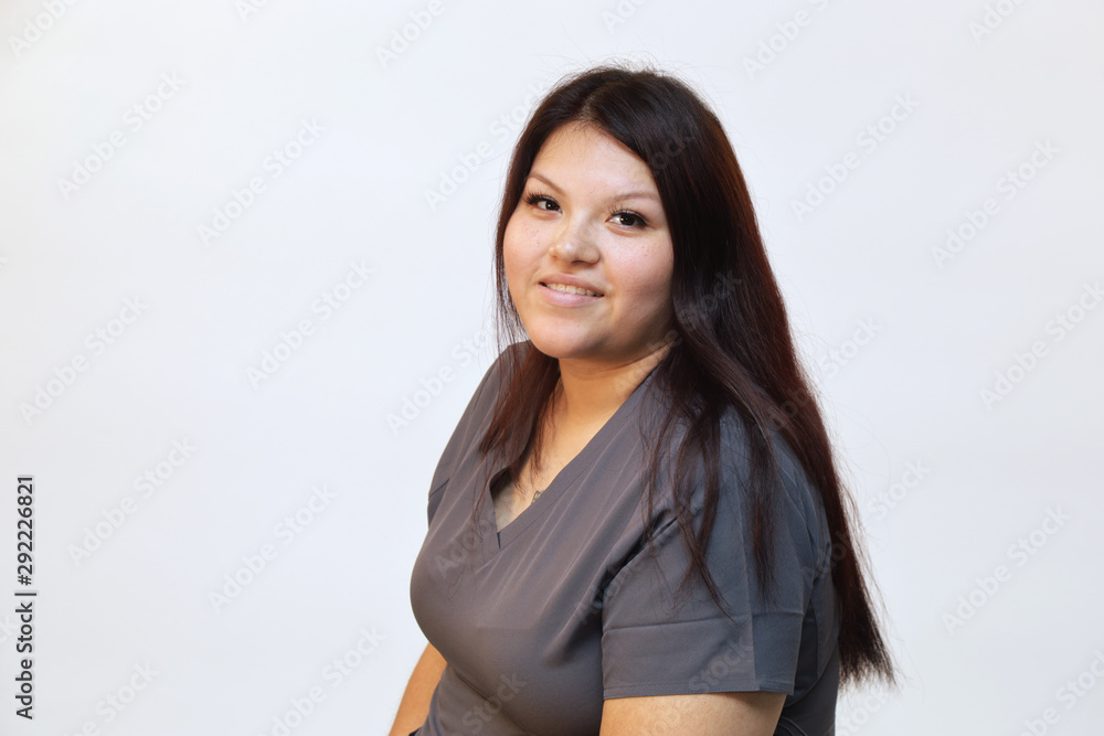 Portrait of a young female healthcare professional, a woman nurse on white background Portrait of a young female healthcare professional, a woman nurse on white background