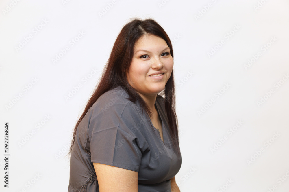 Portrait of a young female healthcare professional, a woman nurse on white background Portrait of a young female healthcare professional, a woman nurse on white background