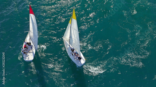 Aerial drone photo of white Sailing boats compete during sailing regatta practise in open ocean exotic sea photo