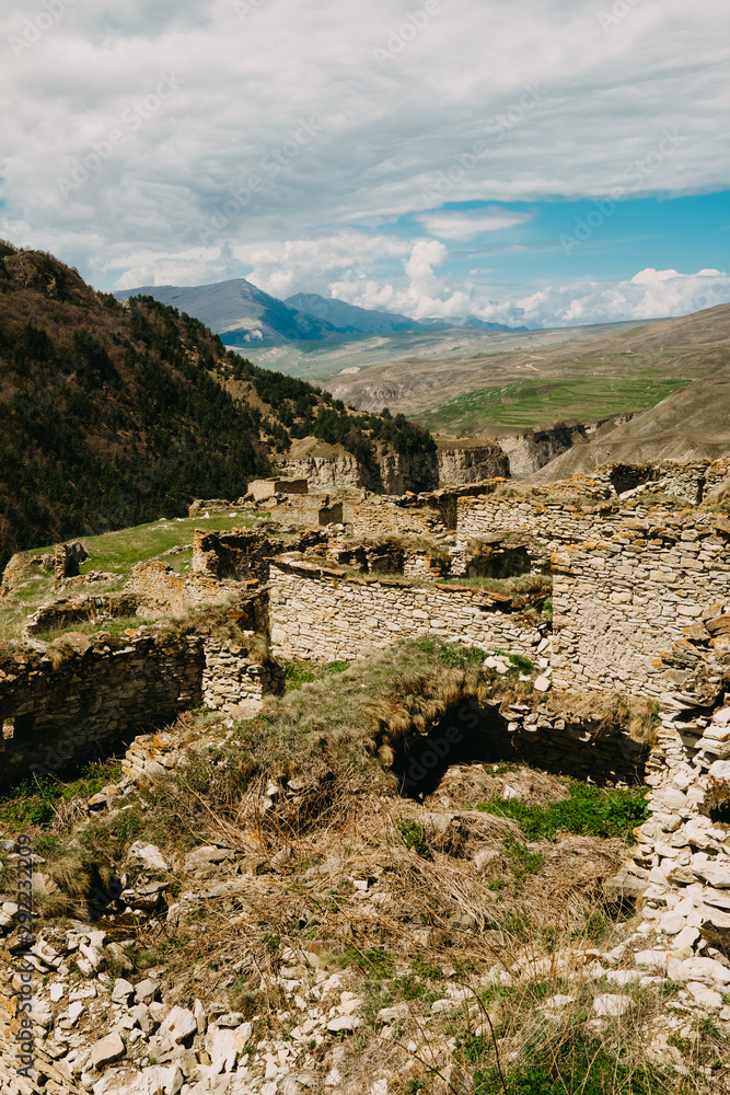 The stone city in Chechnya, the abandoned ruins of buildings, walls, squares, terraces and ramps restore the steep mountainous landscape 