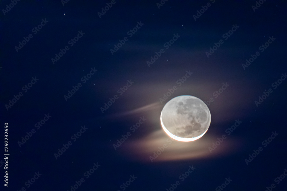 Waxing crescent moon as seeing from the southern hemisphere. Amazing the moon rough surface full of craters from meteorites coming from the universe and crashing our satellite the Moon an awe relief Waxing crescent moon as seeing from the southern hemisphere. Amazing the moon rough surface full of craters from meteorites coming from the universe and crashing our satellite the Moon an awe relief