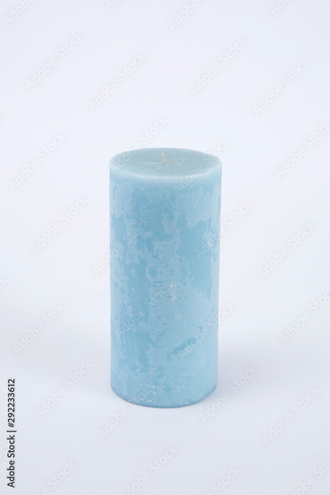 Blue candle on the white isolated background Blue candle on the white isolated background