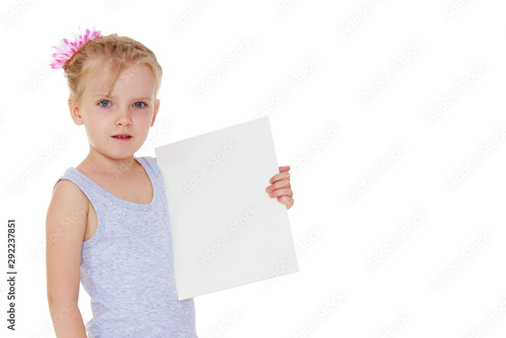Little girl is showing a finger.The concept of advertising goods Little girl is showing a finger.The concept of advertising goods