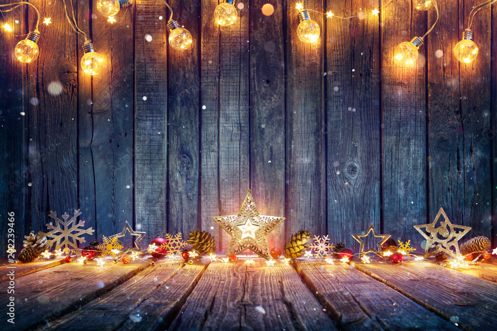 Christmas Decoration With Stars And String Lights On Rustic Wooden Table - obrazy, fototapety, plakaty 