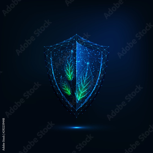Futuristic glowing low polygonal shield with green leaves isolated on dark blue background.