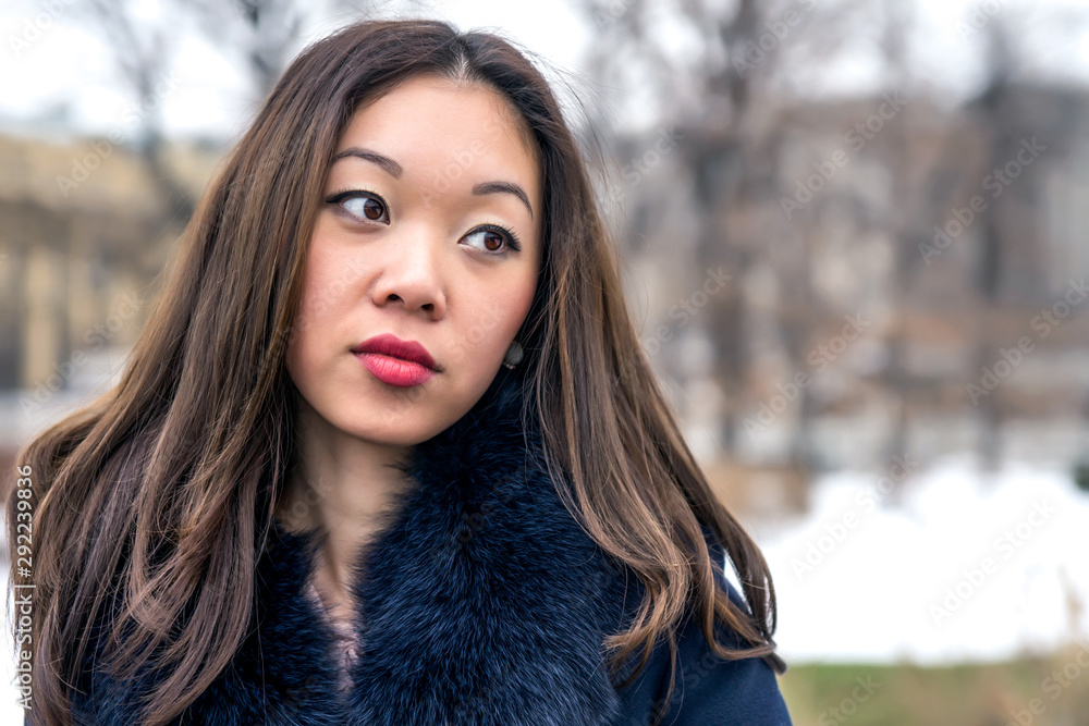 portrait of a beautiful Asian girl looking sideways portrait of a beautiful Asian girl looking sideways