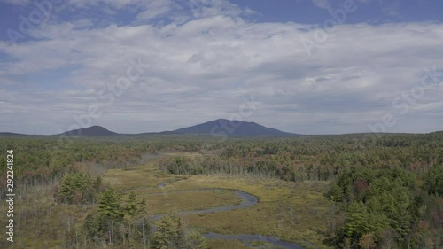 Aerial drone video moving towards Mt Monadnock over forest and creek during autumn in New Hampshire photo