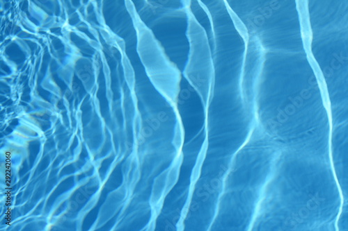 Surface of blue swimming pool,background of water in swimming pool. Water background blue.