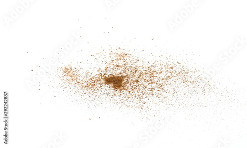 Spice cinnamon powder isolated on a white background. Cinnamon powder spilled on a white surface. © Sanja