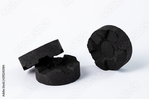 Isolated charcoal for waterpipe on white background © mathefoto