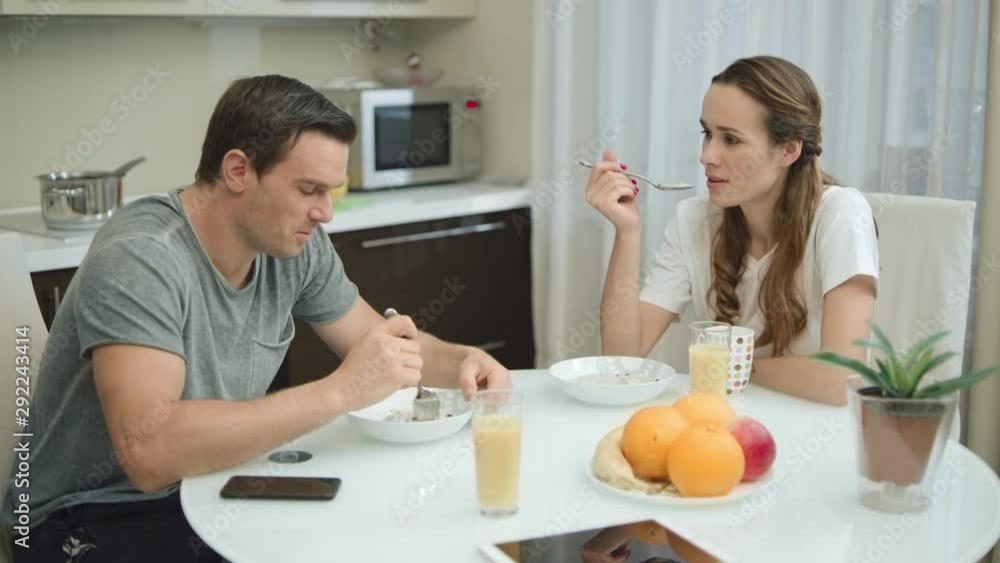 Happy couple having breakfast together at home. Happy couple having breakfast together at home.