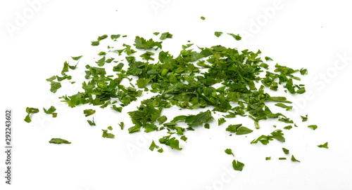 Fresh green chopped parsley leaves isolated on white background and texture, top view. Chopped parsley on a white background isolated. Chopped Parsley Leaves. Fresh Herbs  © Sanja