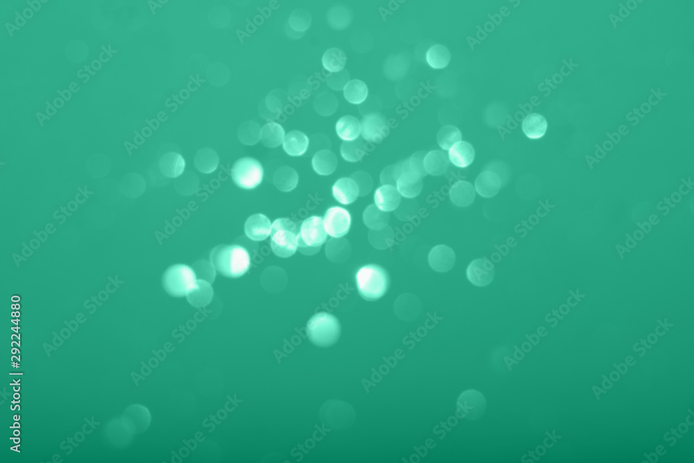 Abstract composition. Greeny blue mint leaf glitter light background with beautiful bokeh