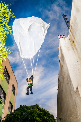 Toy skydiver, using a grocery bag as a parachute, a traditional 1980s joke.