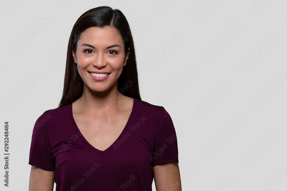 Commercial headshot advertising portrait of a beautiful young asian american brunette woman with perfect white teeth smile Commercial headshot advertising portrait of a beautiful young asian american brunette woman with perfect white teeth smile