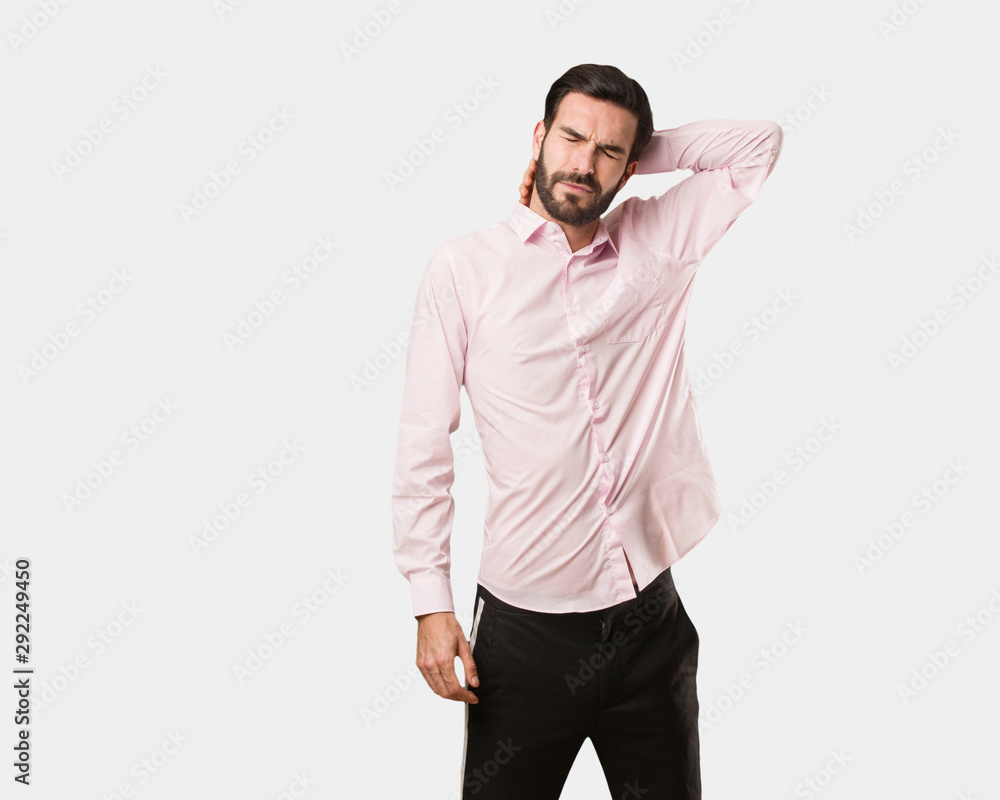 Young handsome man suffering neck pain Young handsome man suffering neck pain