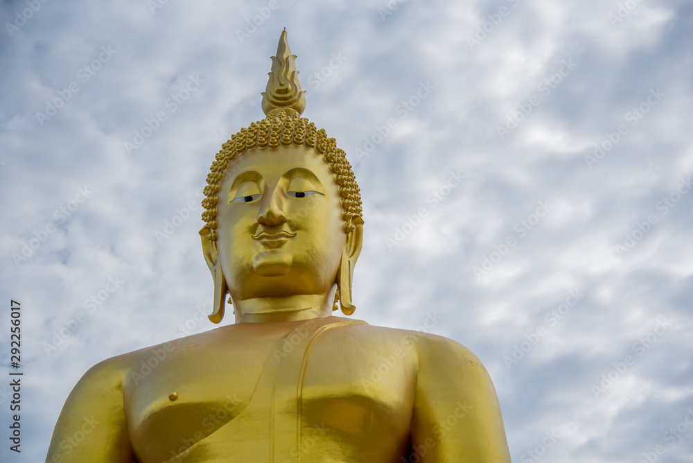 portrait of a large golden Buddha in Thailand