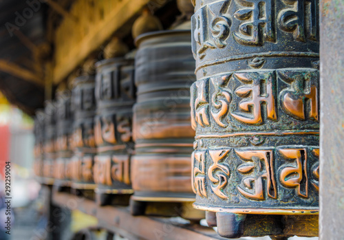 Spinning prayer wheels at Swayambhunath Stupa, Kathmandu, Nepal.