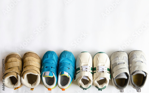 many kid shoes on white background.colorful kid shoe.
