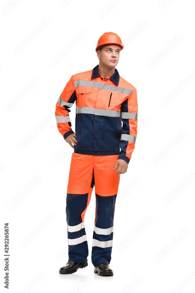 Man in working clothes and helmet isolated shot Man in working clothes and helmet isolated shot