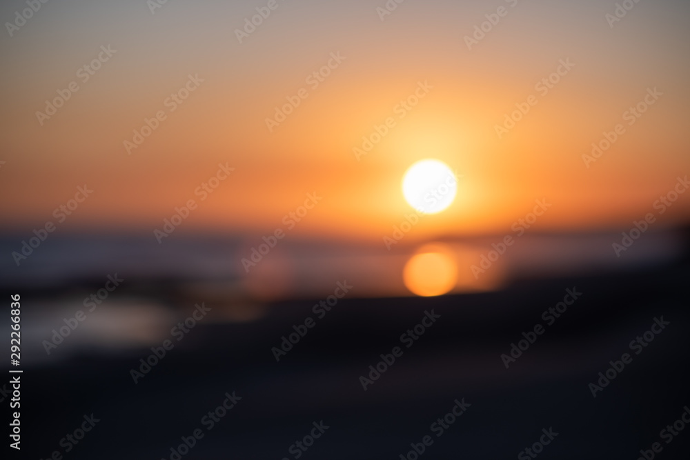 Plakat Defocused background of sunset over horizon