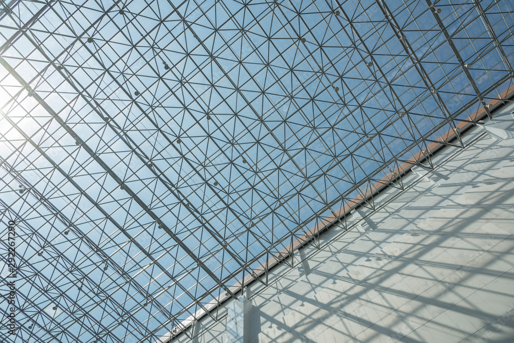 Fototapeta premium Modern interior building wall and golden network glazing structure