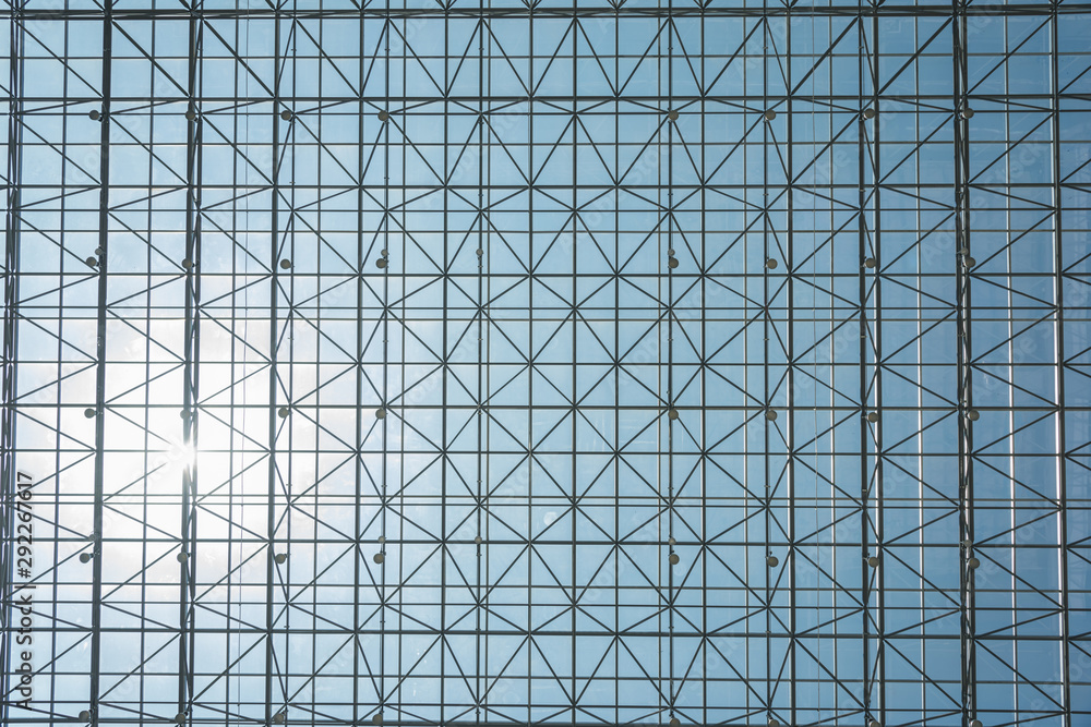Indoor metal mesh transparent glass roof sky background