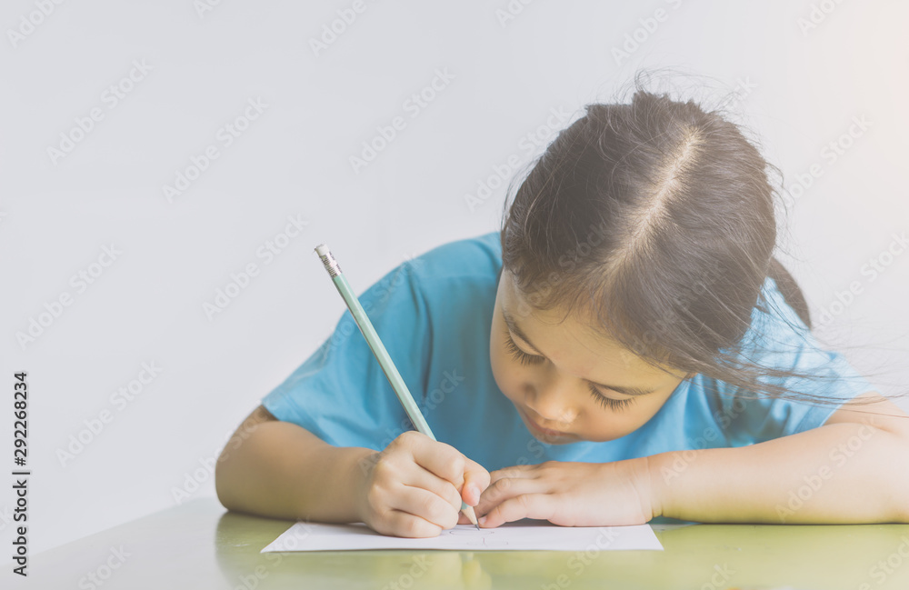 Asian girl writing, pencil, paper education concept. Asian girl writing, pencil, paper education concept.