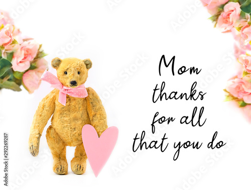 Mom, thanks for all that you do - greeting card. cute Teddy bear with heart and flowers on white background. Mother's day holiday concept © Ju_see
