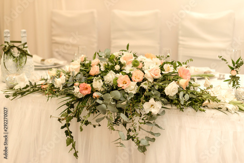 Beautiful flowers on table in wedding day. Rustic style wedding table decoration and setting