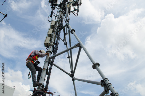 engineer working on high telecom tower,Maintenance conceptual photo
