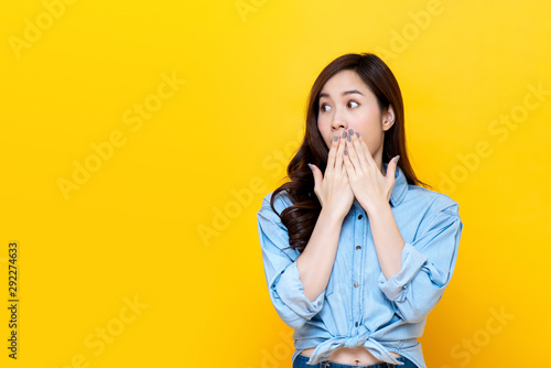 Tableau sur toile Shocked woman covering mouth with hands