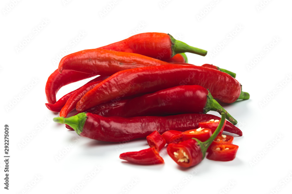 Closeup top view red chili pepper with sliced on white background, raw food ingredient concept Closeup top view red chili pepper with sliced on white background, raw food ingredient concept