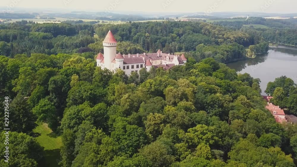 Landscaping view of Konopiste Castle located near green forest and sparkling lake, Czech Republic Landscaping view of Konopiste Castle located near green forest and sparkling lake, Czech Republic