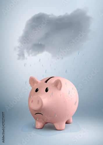 savings at risk concept, piggy bank in the rain photo