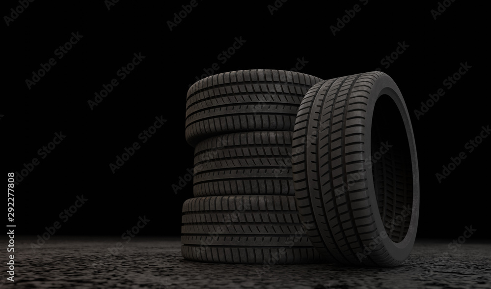 Obraz premium 3D car tires stand in the dark