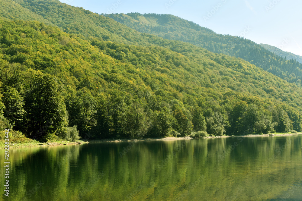 View of the lake and mountains. Beautiful nature view. View of the lake and mountains. Beautiful nature view.