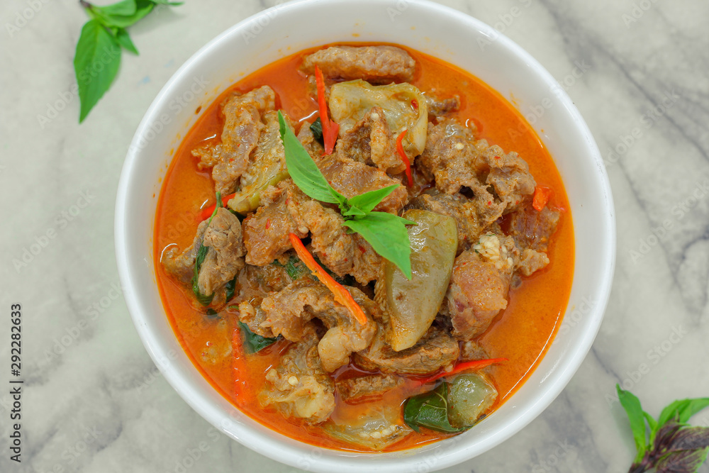 Beef in red curry with coconut milk and holy basil