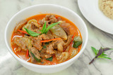 Beef in red curry with coconut milk and holy basil